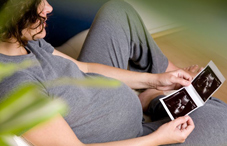 Pregnant woman looking at ultrasound