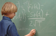 Student doing math on chalk board