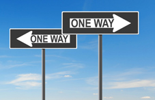 "One Way" signs pointing in opposite directions