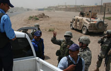 Soldiers and vehicles at checkpoint