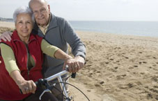 Husband hugging wife on bike