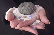 A rock with "Trust" engraved on it