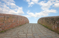 Brick wall and stone pathway