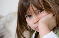 Girl leaning head against her hand