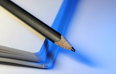 Pencil laying on a notebook