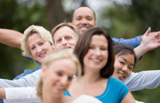 Train of people with their arms out