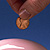 Putting a penny in a piggy bank