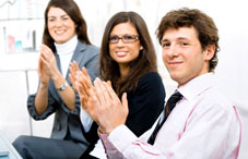 Man and two women clapping
