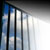 Light shining through window bars
