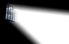 Light shining through window bars