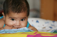 Baby laying on blankets