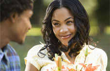 Man giving woman flowers
