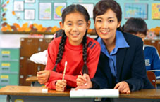 Teacher and student at desk