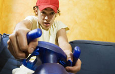 Boy playing video game steering wheel