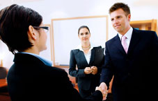 Shaking hands in business environment
