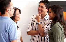 People standing around smiling