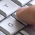 Fingers on a computer keyboard