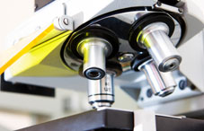 Microsope with four lenses