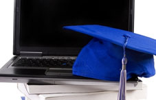 Graduation cap on a laptop