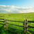 Wood fence on a grass field