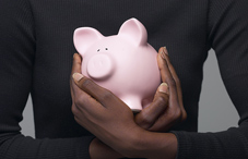 Holding a piggy bank