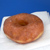 A doughnut, coffee and a newspaper