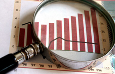 Magnifying glass on bar graph