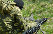 Army soldier sitting on the grass