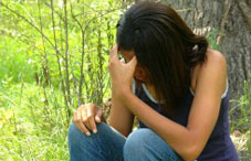 Sad girl holding her head down