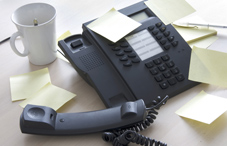 Telephone off the hook and post-it notes 