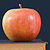 An apple on a stack of books