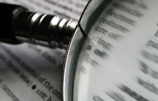 Magnifying glass on book