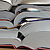 Stacked open books