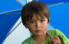 Child under umbrella