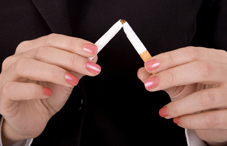 Woman's hands breaking cigarette