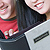 Closeup of couple looking at photos and remembering