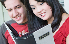 Couple looking at photos and remembering