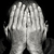 Man with hands over his face