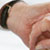 Man holding elderly's hand