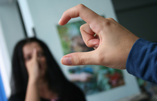 Two people conversing in sign language
