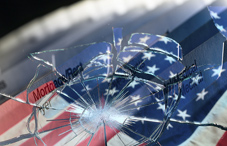 Broken glass over American flag