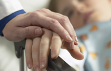 Doctor hands with pediatric hospital patient