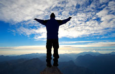 Man on top of mountain