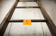 Ladder with up arrow sticky note