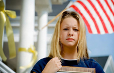 Young woman holding photo of soldier