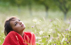 Student daydreaming in field