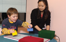 MIT gradutate student Hyowon Gweon works with a child in an experiment to test whether prior beliefs about objects affect children's interpretations after they learn new things about them.
