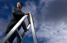 Woman climbing ladder