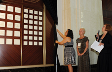 APF’s Kim Rowsome unveiled the wall of “Visionary Circle” donors at APF’s reception. (credit: Stephanie Gross)