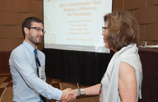 William Martinez, a clinical-child grad student at DePaul University, advocated for the Minority Fellowship Program, which supports psychology students dedicated to minority mental health. Dr. Nina Thomas of the Public Interest Caucus (right) presented him with a Public Interest advocacy scholarship. (credit: Nick Crettier)